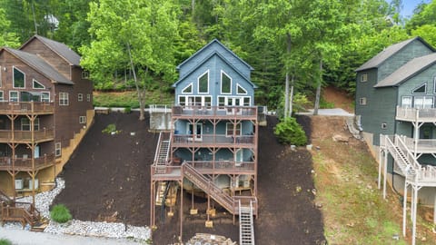 Lakefront home with 3 decks overlooking a cove.  Private 2-story dock w/ slide.