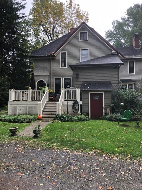 Back of house with  large circular driveway