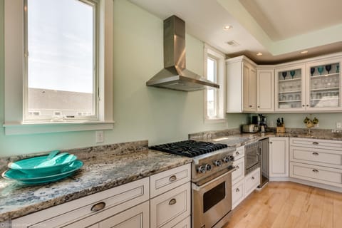 Upscale kitchen with Viking appliances, quartz counters & open, spacious layout