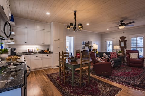 The interior is beautifully appointed with antiques and oriental rugs.