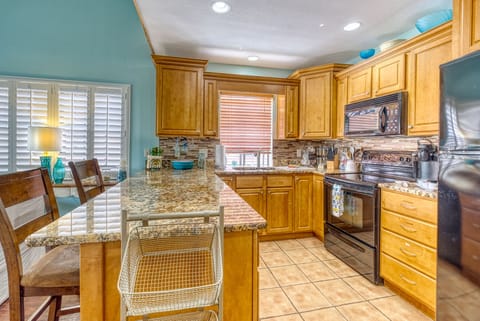 You can cook a big meal in this kitchen supplied with everything you need