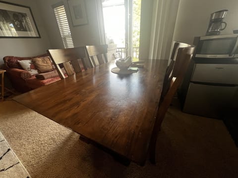 Extra large wooden table to set up your work station. Sits 4 comfortably. 