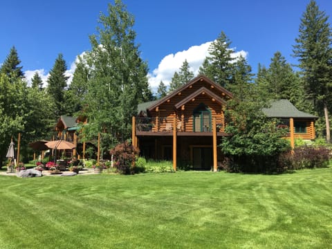 The Guest House with wrap around deck and lower patio. 