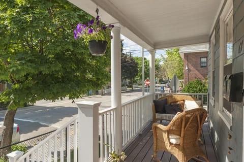 Front Porch-comfortable sitting area, very sunny all afternoon-evening.