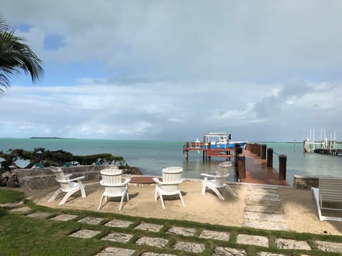 Enjoy the Florida Bay! Outdoor chairs, lounge chairs & fire pit by the water