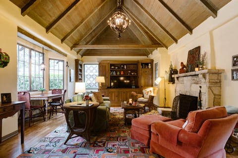 Spacious living room with Carmel stone fireplace.