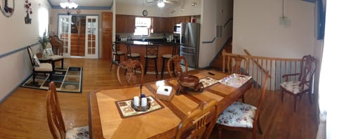 DINING ROOM; KITCHEN; STAIR LEADING TO ENTERTAINMENT ROOM