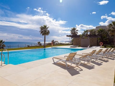 Pool complete with sunloungers