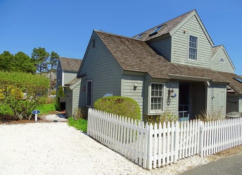 Front of house, showing parking space & entrance to back patio