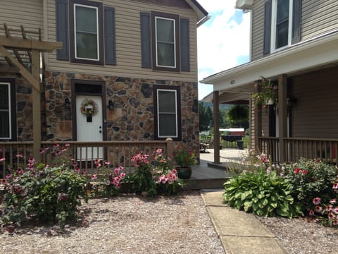  Your apartment is the first floor of the house with the stone front. 