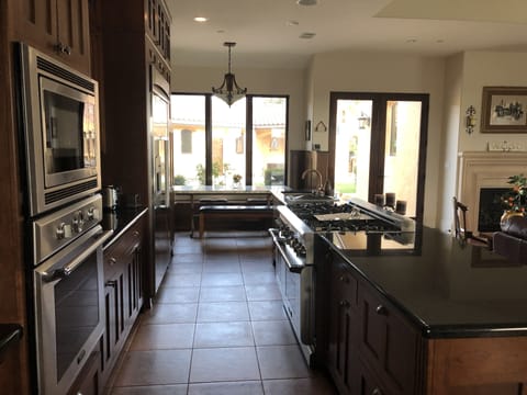 Built-in kitchen table at far end.