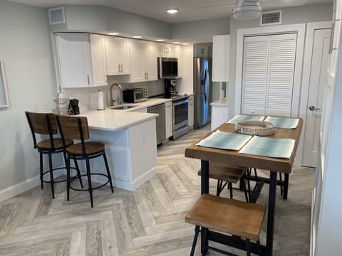Kitchen with dishwasher, oven, stove, microwave and fridge (ice/filtered water)