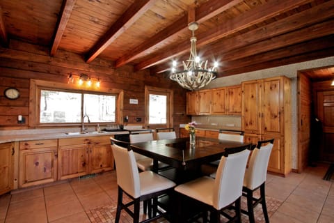 The table seats six!  There are extra chairs in the game room.