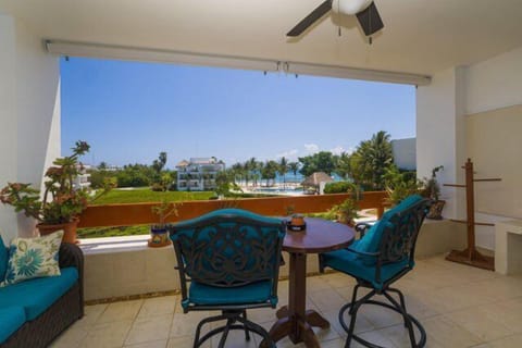 Terrace with small table and seats, expansive ocean views