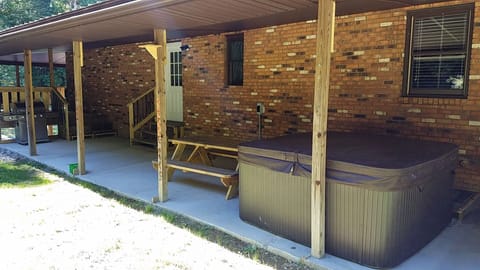 Back Porch with 7 person hot tub and stainless steel gas grill