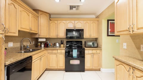 Large kitchen, dishwasher, stove, microwave and disposal 