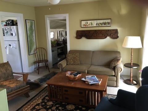 Living room off the north bedroom & full kitchen.