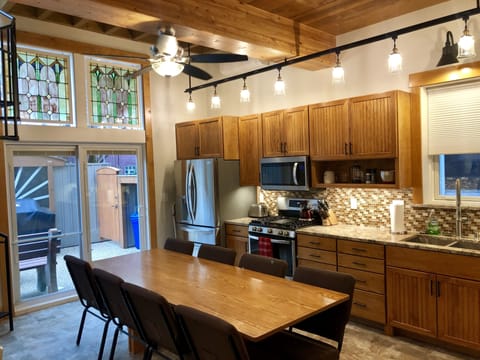 Kitchen with a view of the door to the patio and stained glass
