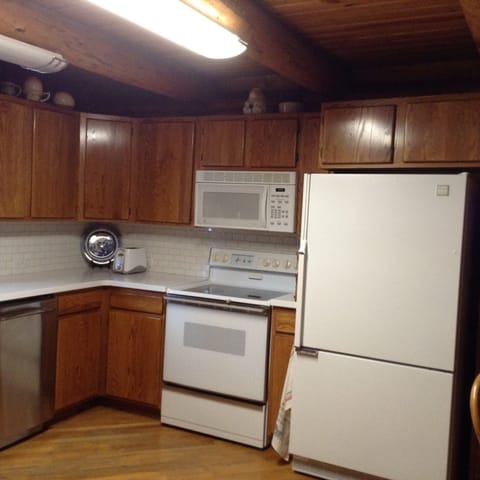 Kitchen, range, microwave and refrigerator