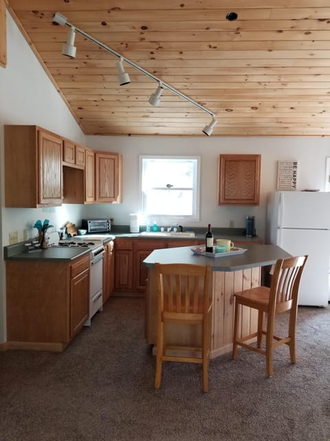 Open concept kitchen with breakfast bar island.