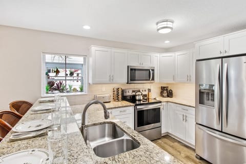 Kitchen has new cabinets, countertops, and stainless steel appliances