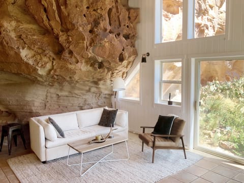 Living room area built into the sandstone rock face