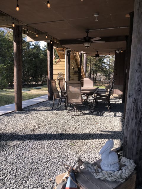 Shaded below deck area with seating for 6. 