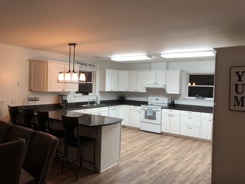 Oversized, fully stocked kitchen. 