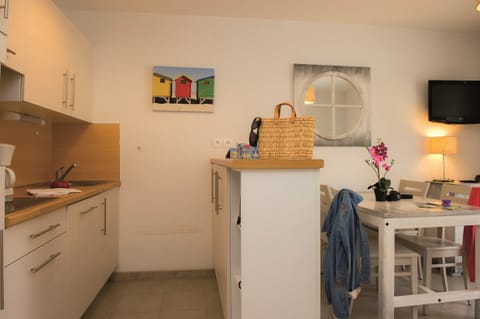 The living area is bright and charming, perfect for your vacation.