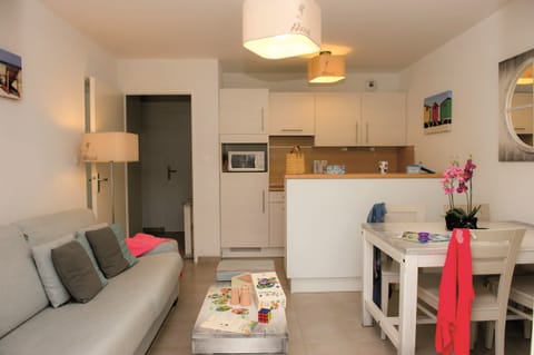 Prepare meals in the kitchenette and enjoy them at the dining table.