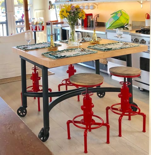 Work station and dining room table on wheels, made from a bowling alley.
