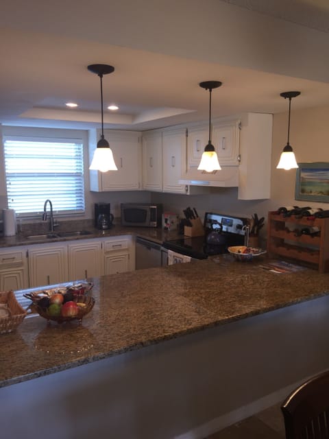 Granite counter tops and openness to dining and family rooms
