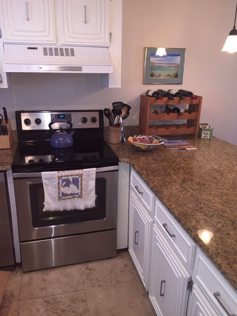 Lots of cabinets loaded with dishes, skillets, pots, serving dishes, silverware