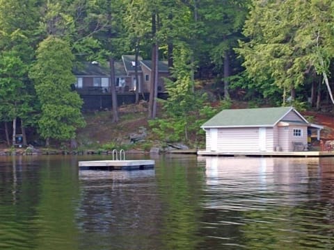 View of Cottage and Boathouse from Lake - private swin raft included