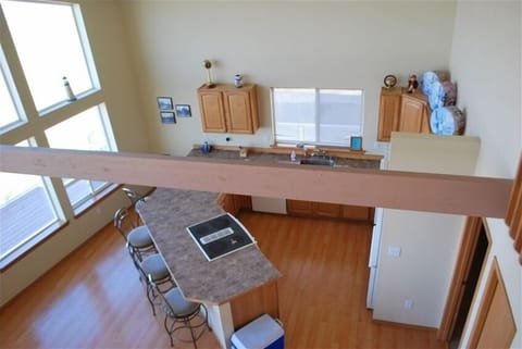 Upstairs view from the loft looking down to the kitchen
