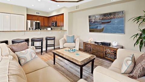 Wall mounted 70 inch TV with cable & streaming channels.