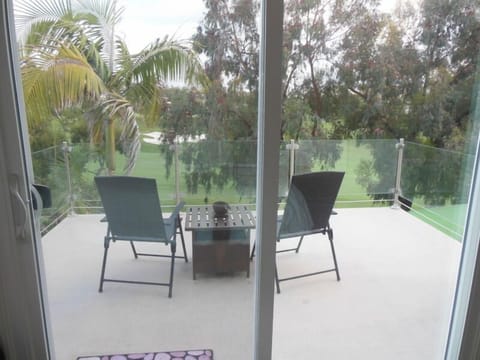 Balcony off master bedroom with golf course and Ocean view.