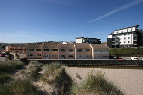 Exterior of villas and path to beach