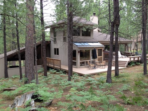 Golf course view of home and deck
