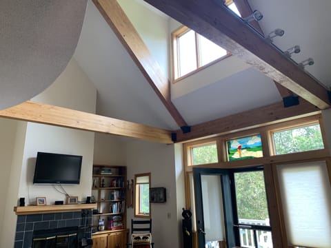 Post and beam ceilings with mountain and golf course views.