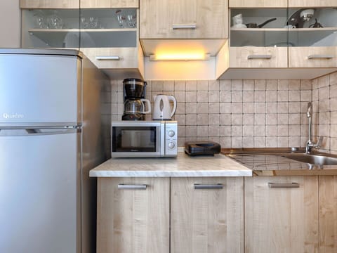 Kitchen Appliance, Kitchen, Countertop, Cabinetry, Major Appliance, Furniture, Home Appliance, Interior Design, Wood, Kitchen Sink