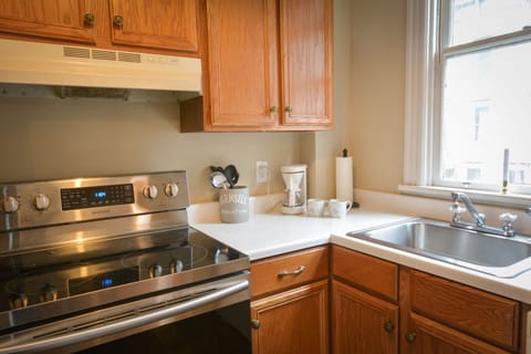 Kitchen is fully equipped with an electric range