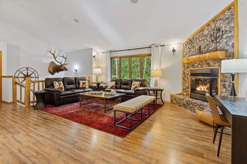 Upstairs Great room with river rock fireplace