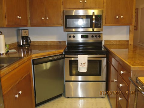 THE KITCHEN IS FULLY EQUIPPED WITH ALL NEW STAINLESS STEEL APPLIANCES
