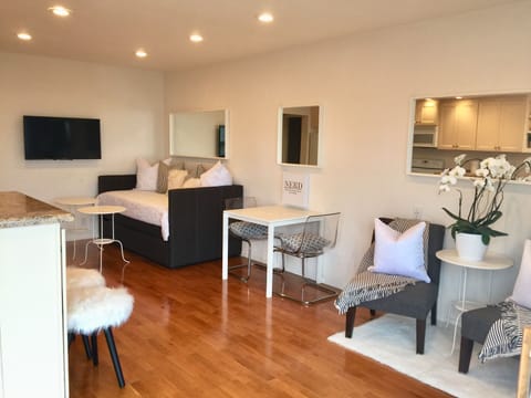 Main Room: Daybed/Trundle, Kitchen Table & Chairs, Reading Chairs, TV & Kitchen