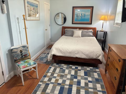 Queen bed and large mounted tv with YouTube tv and Netflix