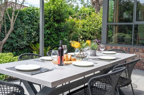 The patio is a great place for meals.  It has a BBQ and large eight seat table.