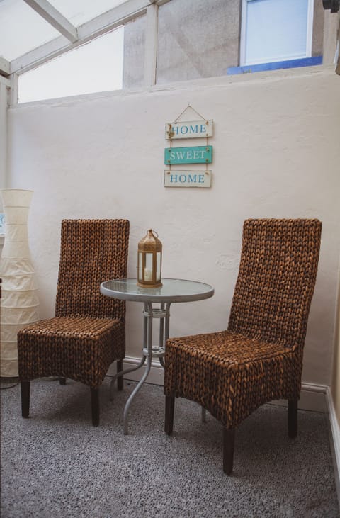 Undercover seating area at the back of the house.