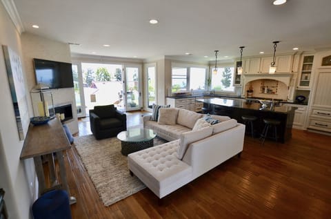 Back living room + kitchen with french doors to the backyard