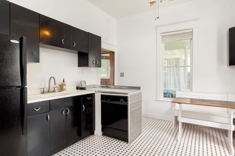 Metal cabinets and new quiet dishwasher, disposer switch under sink in cabinet.